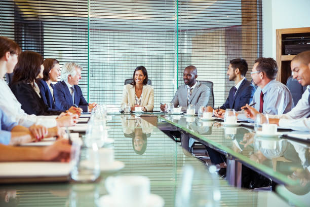 Group of professionals sitting around a conference table